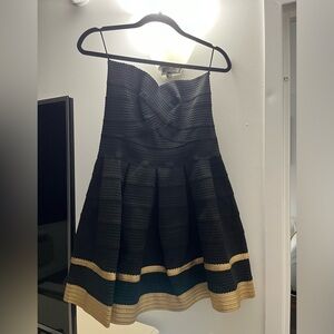 Never worn. With tags. Women’s Alythea Black and Gold Dress. Size Large